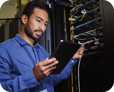 server technician reviewing system performance on a tablet