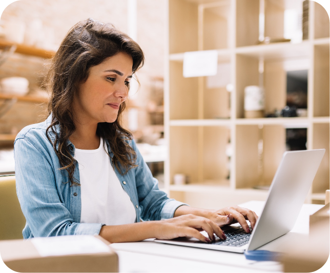 woman typing at a laptop