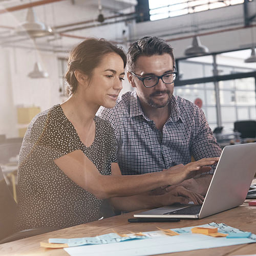 Two People at Laptop